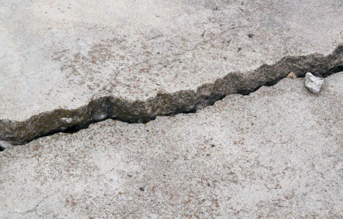 Close-up of cracked concrete surface showing repair needs in Leavenworth, KS