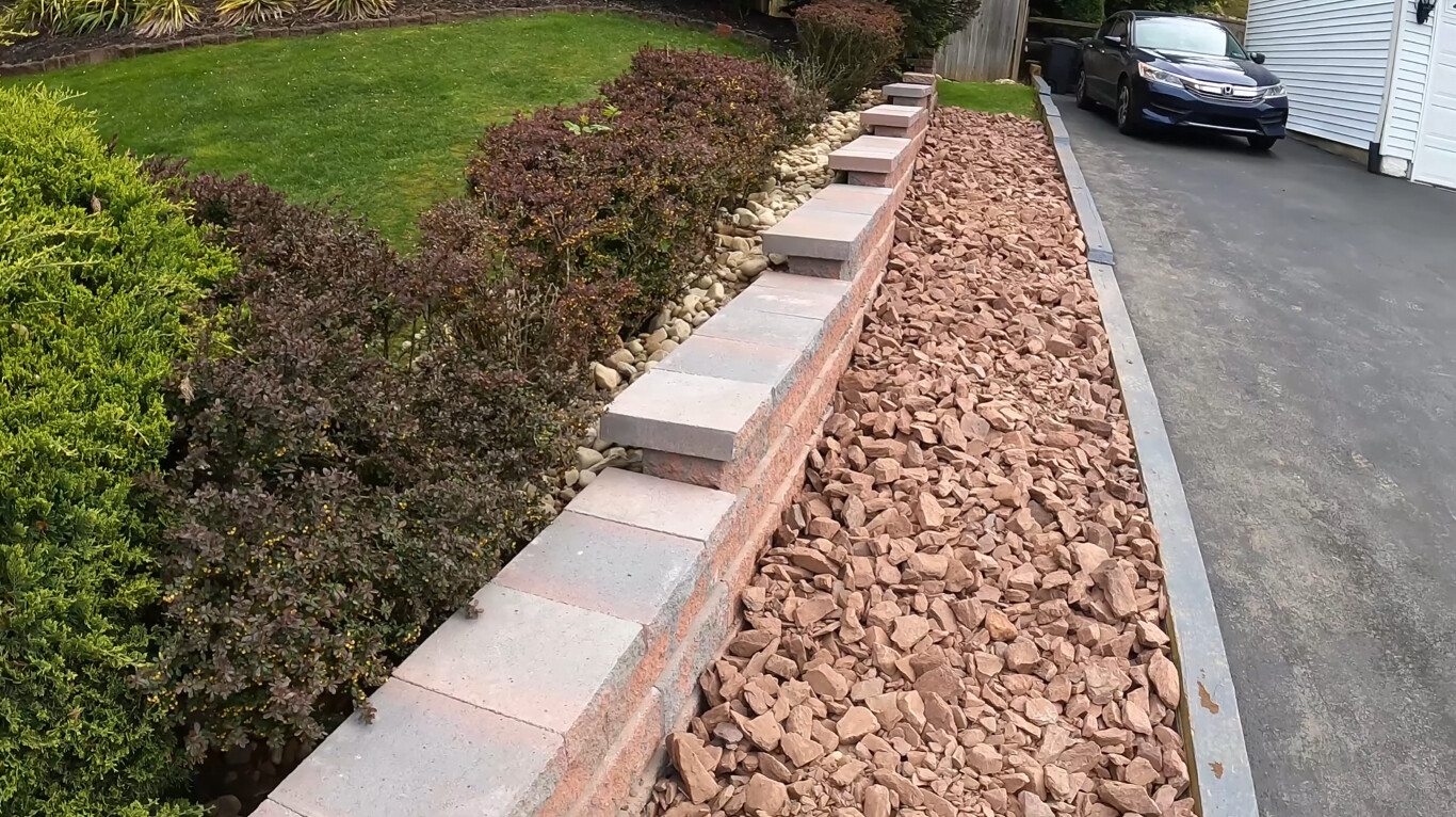 Decorative concrete steps with brick retaining wall and landscaping in Leavenworth, KS